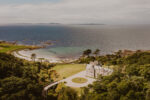 Ronachan House sits nestled into a secluded woodland hillside with spectacular views across sandy Ronachan Bay to the islands of Islay and Jura beyond Ronachan House sits nestled into a secluded woodland hillside with spectacular views across sandy Ronachan Bay to the islands of Islay and Jura beyond